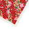 Grossformatiges rotes Japanpapier Washi mit feinem Punktemuster, traditionellen japanischen Temari-Bällen und bunten Blüten.